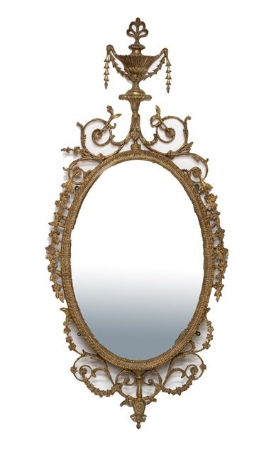 Appraisal: A George III gilt framed wall mirror with urn crest