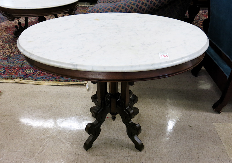 Appraisal: A VICTORIAN MARBLE-TOP WALNUT LAMP TABLE American last quarter of