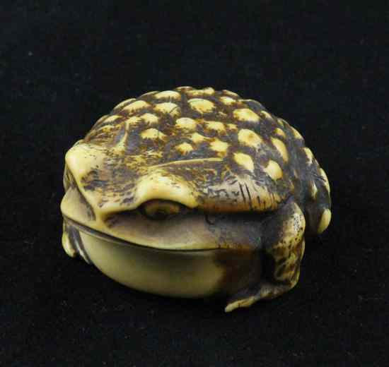 Appraisal: A Meiji period ivory netsuke carved as a toad with