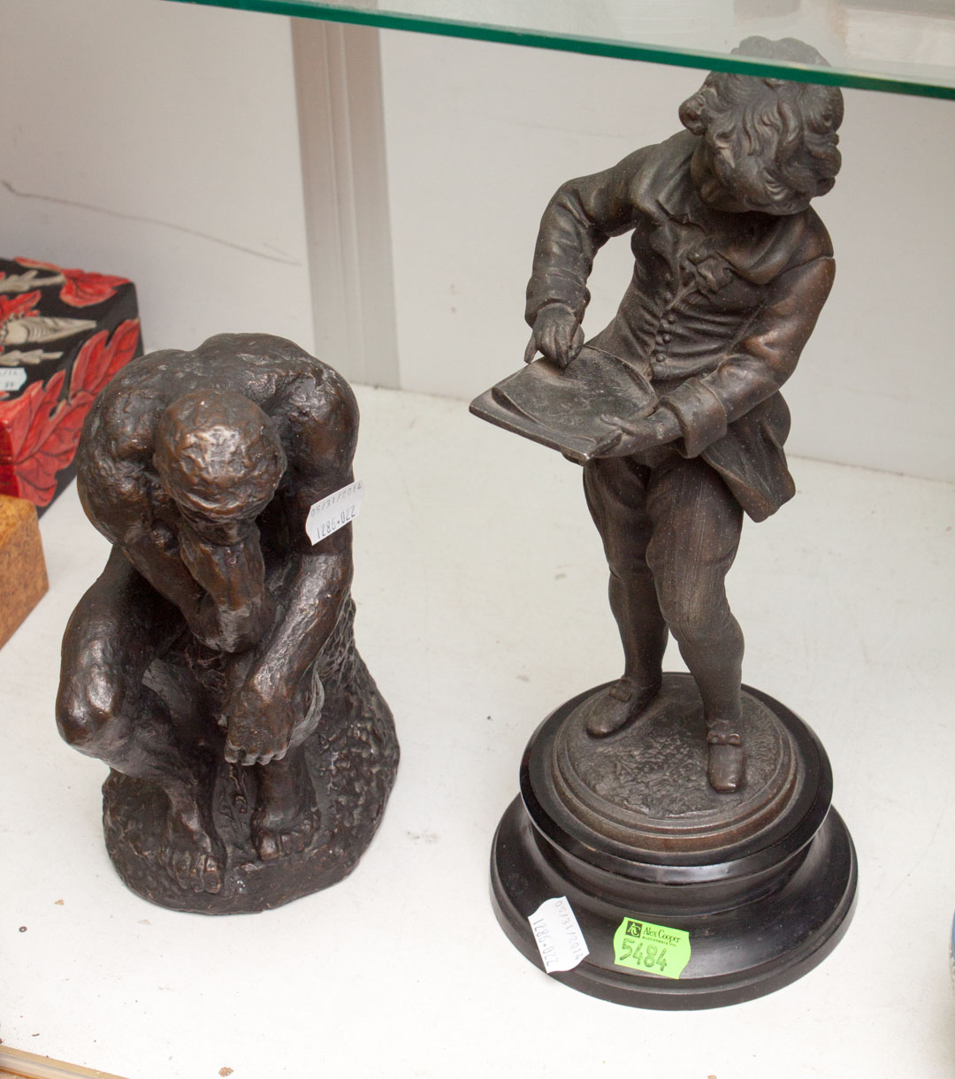 Appraisal: Two metal sculptures spelter metal figure and a metal clad