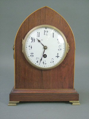 Appraisal: An Edwardian mahogany lancet cased mantel clock with French movement