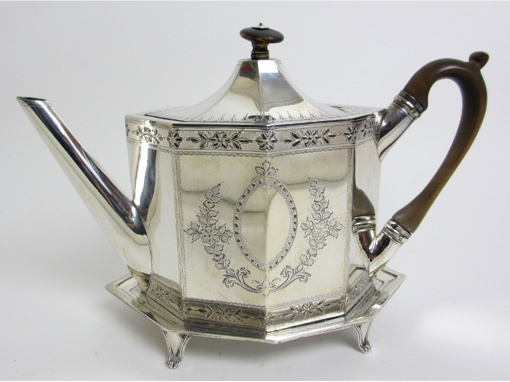 Appraisal: A George III silver teapot on stand of straight octagonal