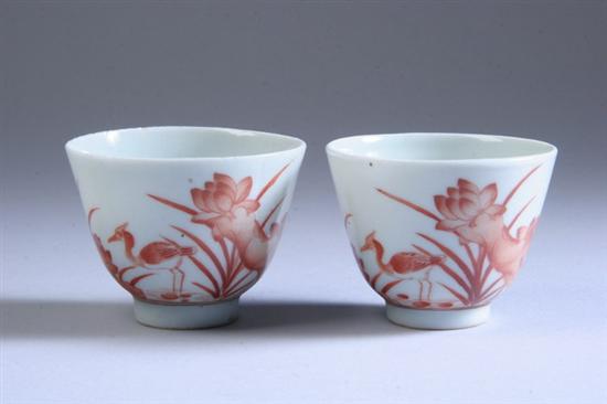 Appraisal: PAIR CHINESE IRON RED PORCELAIN WINE CUPS Iron red Buddhist