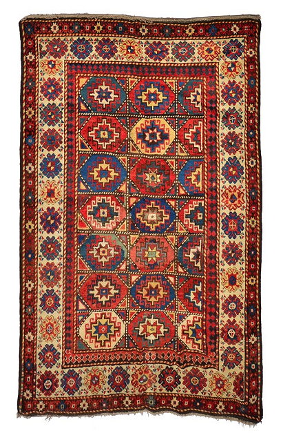 Appraisal: A SOUTHERN AZERBAIJAN MULTI-COLOURED RUG the centre divided into twenty