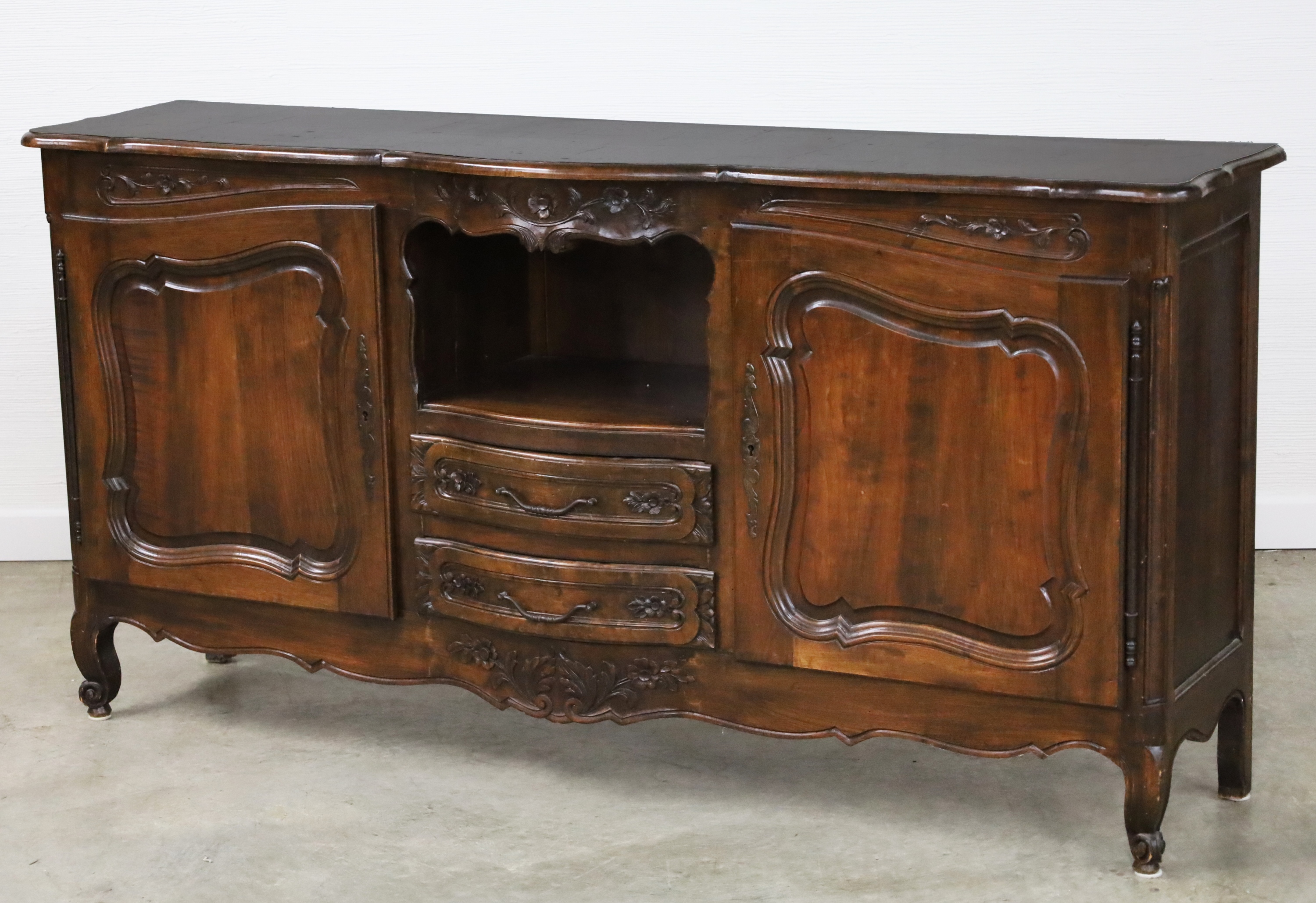 Appraisal: LOUIS XV STYLE CARVED WALNUT BUFFET Louis XV style carved