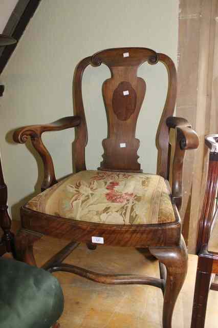 Appraisal: A GEORGE II STYLE WALNUT ELBOW CHAIR with splat back