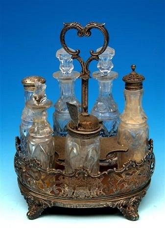 Appraisal: A Victorian silver oval table cruet with pierced gallery fitted