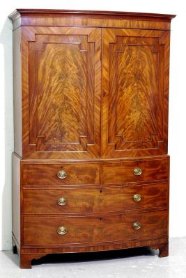 Appraisal: A GEORGE III MAHOGANY LINEN PRESS of bow fronted form