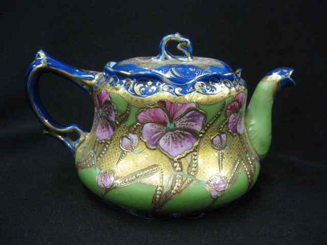 Appraisal: Japanese Porcelain Teapot elaborate floral on green field cobalt trim