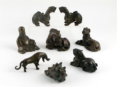 Appraisal: A Chinese bronze model of a horse licking its hind