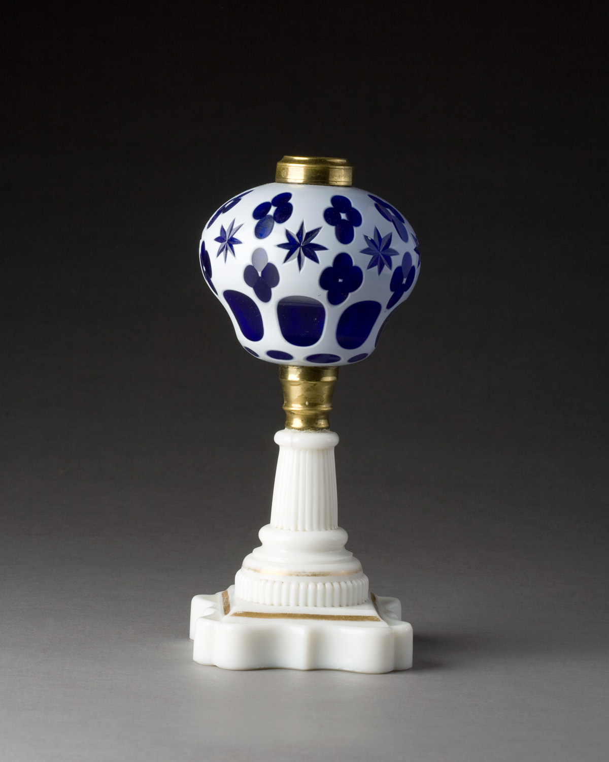 Appraisal: AMERICAN OPAQUE WHITE-CUT-TO-COBALT BLUE DOUBLE OVERLAY 'STAR AND QUATREFOIL' LAMP