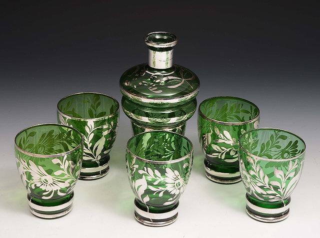 Appraisal: A Venetian green glass lemonade setof stylised form comprising a