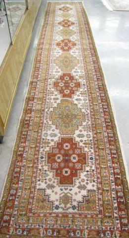 Appraisal: A handmade Oriental runner Kazak cream field nice quality made