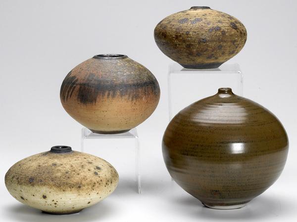 Appraisal: HEINO Four spherical ceramic vessels three covered in volcanic glazes