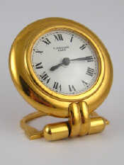 Appraisal: A Cartier gilt quartz desk clock the white dial marked