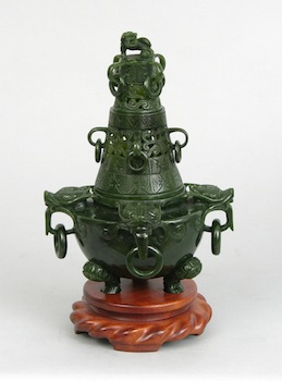 Appraisal: A Deep Green Carved Jade Koro Chinese Deep green jade