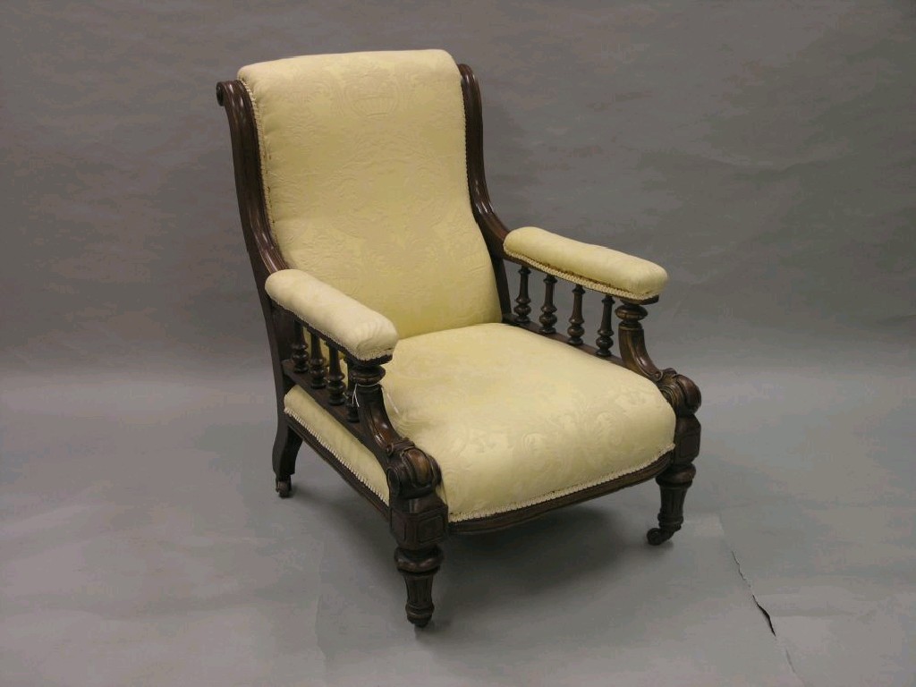 Appraisal: A mid Victorian mahogany-framed armchair with spindle-turned arm supports and