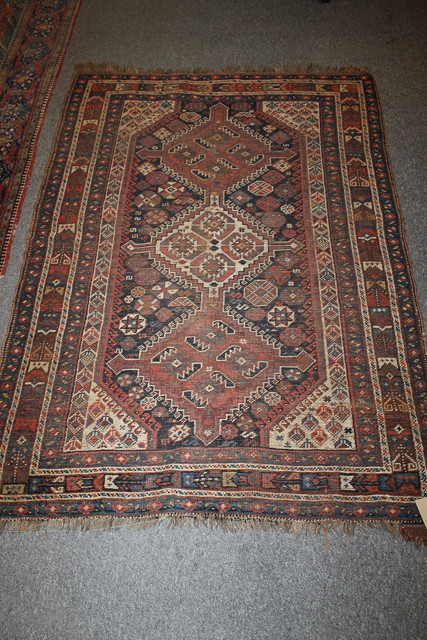 Appraisal: A TH CENTURY AFGHAN RUG with blue and red outside