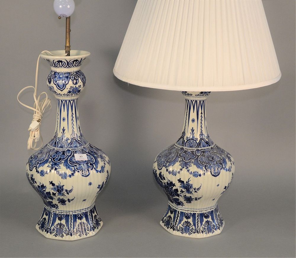 Appraisal: Pair of Delft blue and white urns made into table