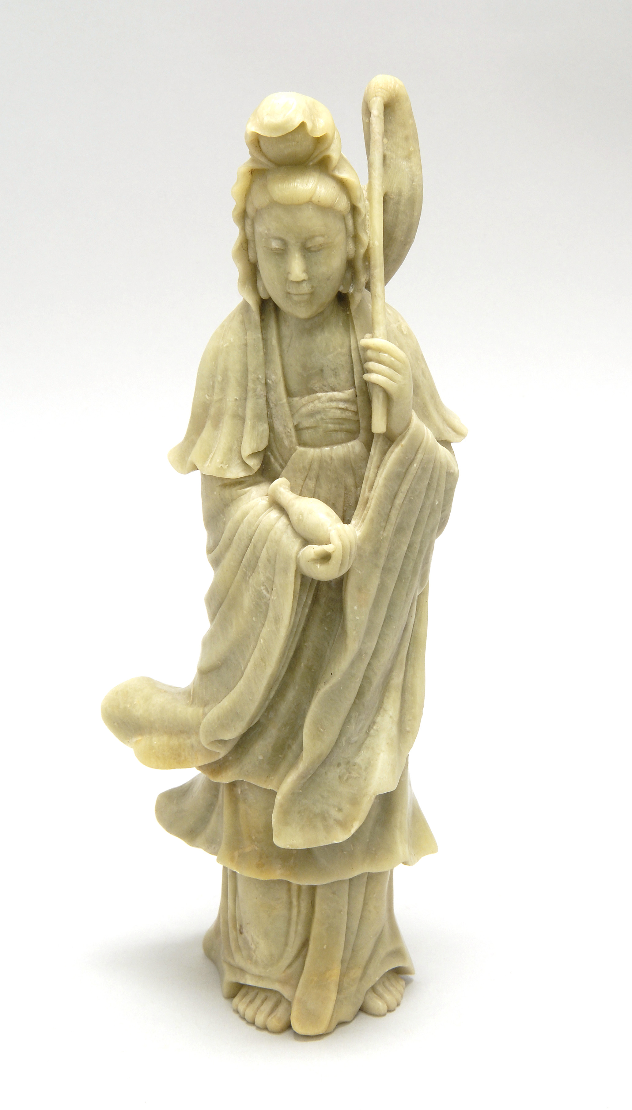 Appraisal: SOAPSTONE FIGURE OF GUANYIN Early th CenturyIn standing position holding