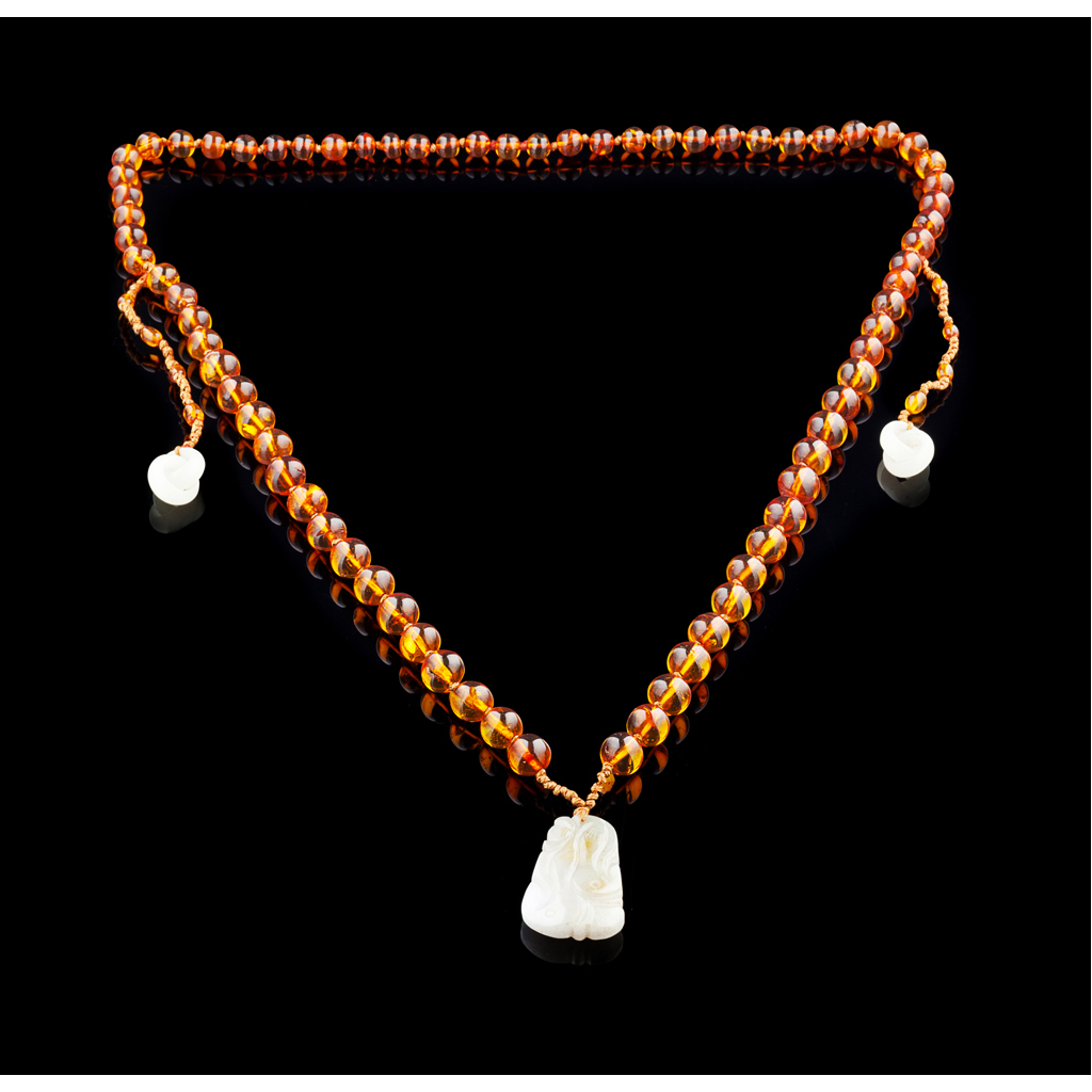 Appraisal: SINGLE STRAND AMBER AND JADEITE NECKLACE composed of a single