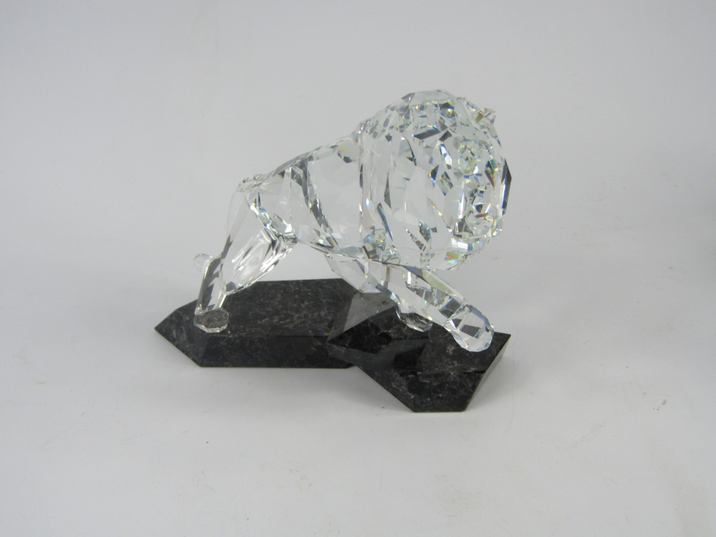 Appraisal: A Swarovski crystal model of a lion designed by Mario