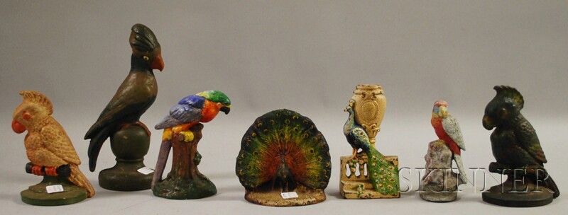 Appraisal: Seven Painted Cast Iron Bird Doorstops including parrots a peacock