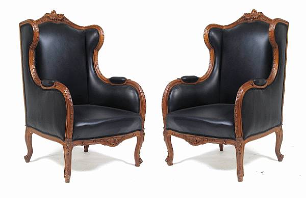 Appraisal: A pair of Louis XV style bergeres with leather upholstery