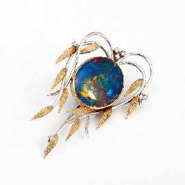 Appraisal: A bi-tone ct gold opal doublet and diamond set foliate