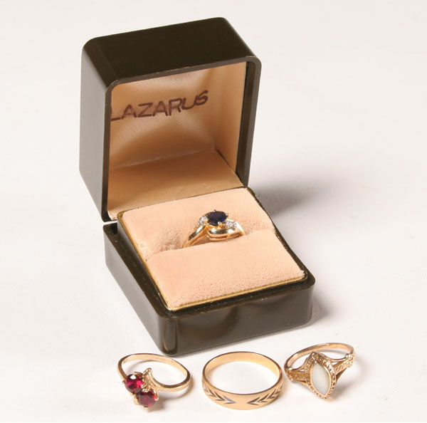 Appraisal: Lot of four gold rings K ring with cobalt blue