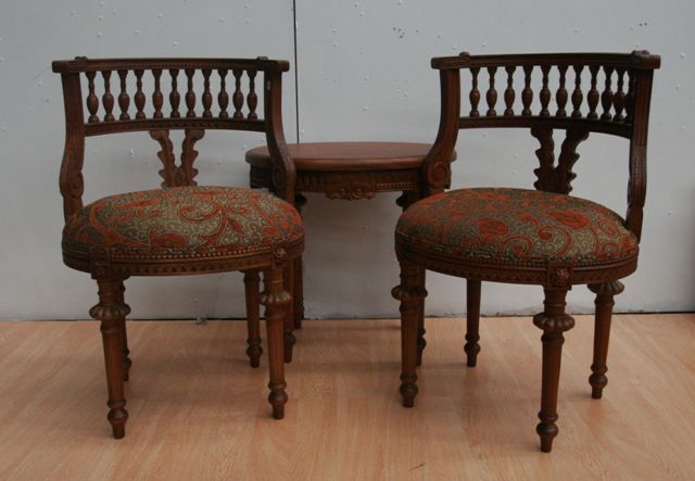 Appraisal: A Louis Philippe style walnut parlour suite including two carved