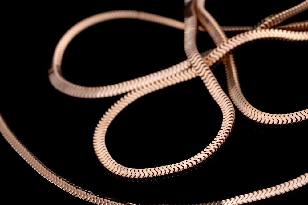 Appraisal: A CONTEMPORARY K GOLD OMEGA CHAIN NECKLACE Marked k on