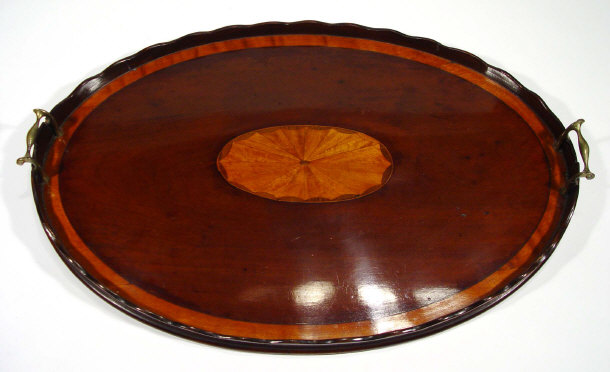 Appraisal: Oval cross banded mahogany gallery tray with oval inlay to