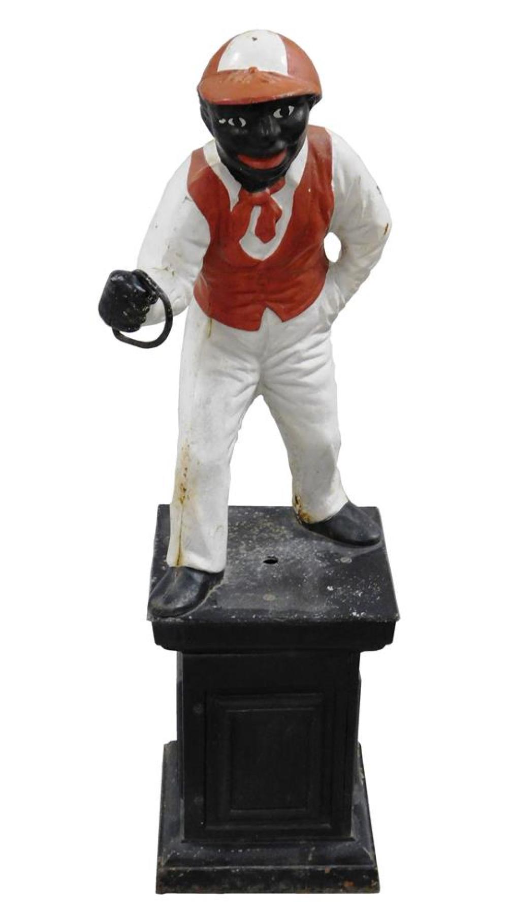 Appraisal: BLACK AMERICANA Cast iron lawn jockey c painted red white