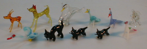 Appraisal: A selection of glass figurines including three black cats