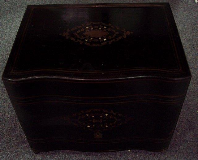 Appraisal: An ebonised decanter box with inlaid decoration cm wide no