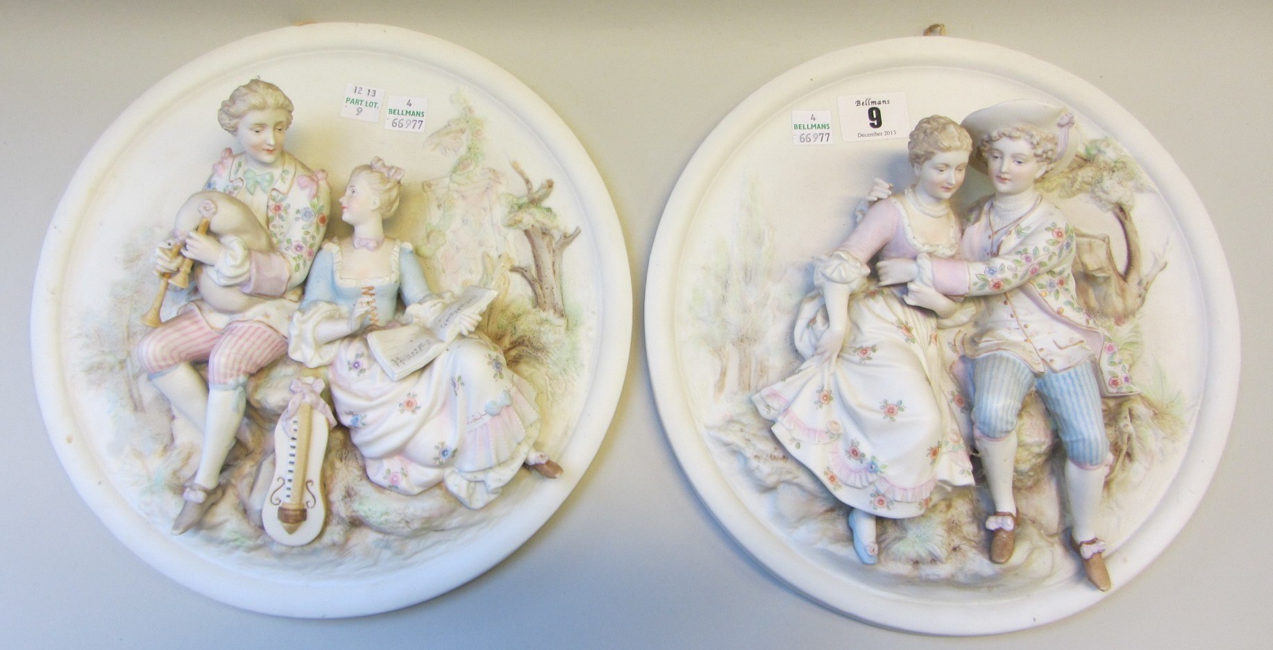 Appraisal: A pair of Continental biscuit porcelain oval plaques each moulded