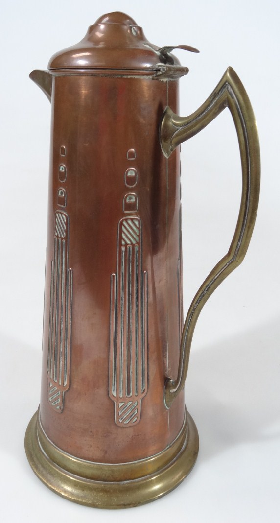 Appraisal: A early thC Tudric style copper and brass flagon in