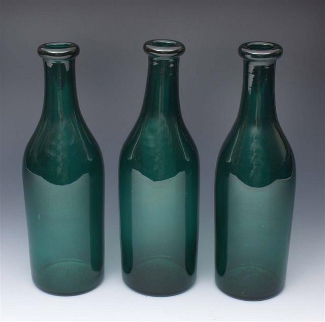 Appraisal: A COLLECTION OF THREE GREEN BOTTLE DECANTERS circa high