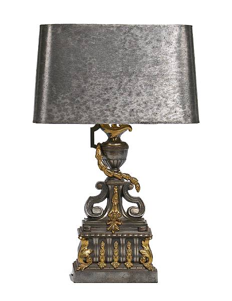 Appraisal: A Louis XVI style iron and gilt bronze chenet now