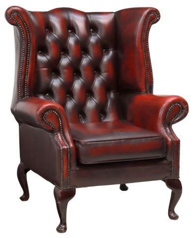 Appraisal: English Queen Anne style wingback armchair th c button-tufted oxblood