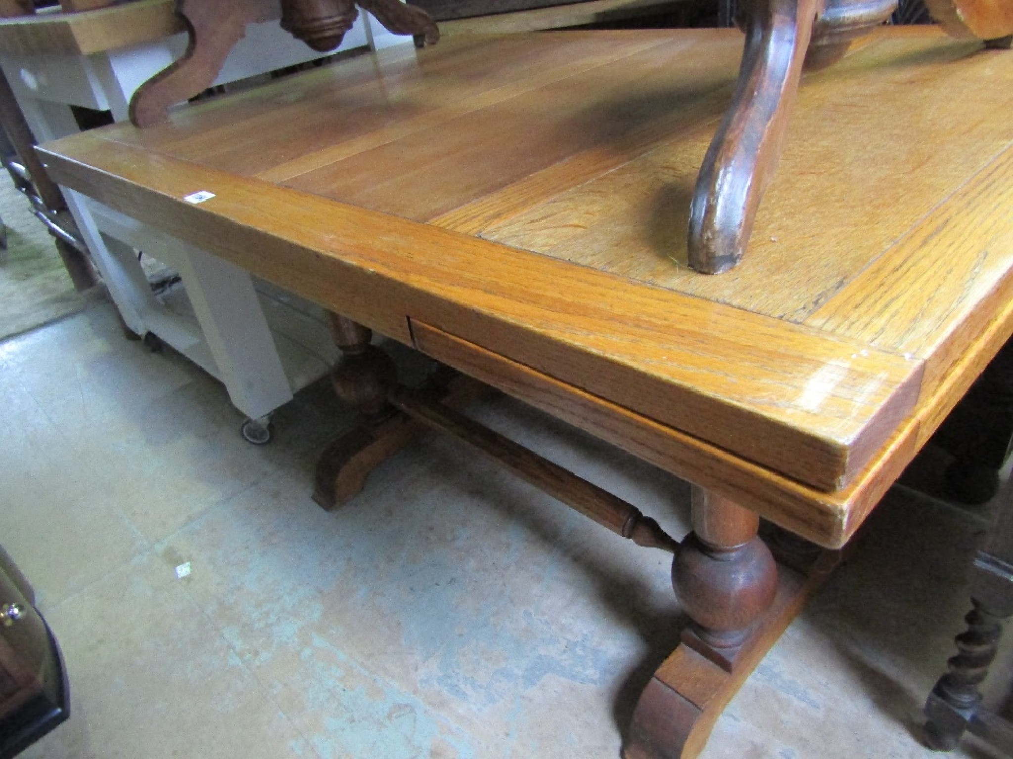 Appraisal: An early th century oak draw leaf dining table raised