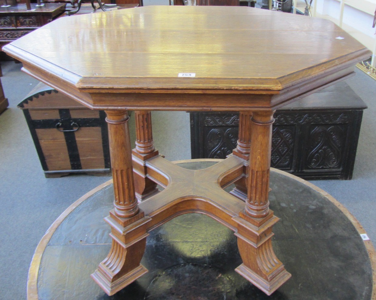 Appraisal: A Victorian oak octagonal centre table on four part fluted