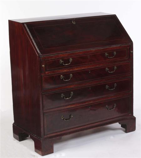 Appraisal: A George III mahogany bureau the boxwood strung fall-flap enclosing