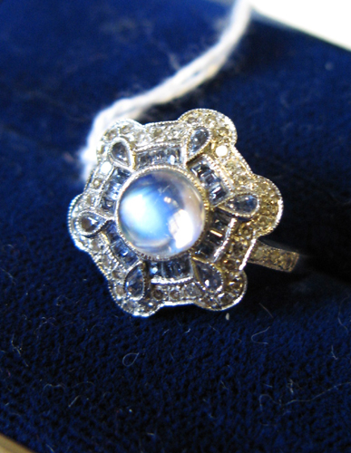 Appraisal: MOONSTONE SAPPHIRE DIAMOND AND EIGHTEEN KARAT WHITE GOLD RING centering