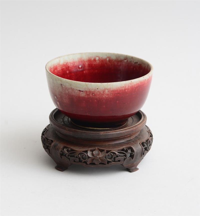 Appraisal: CHINESE FLAMB -GLAZED PORCELAIN FOOTED BOWL Shading from deep red