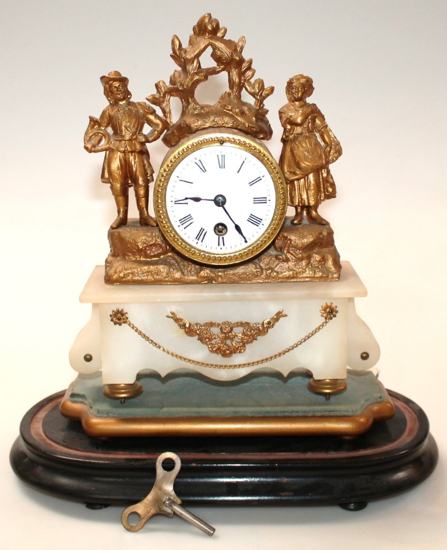 Appraisal: A thC French gilt metal and onyx mantel clock the