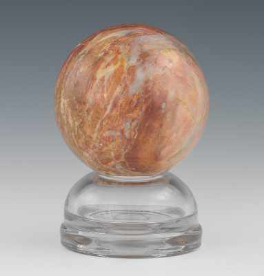 Appraisal: A Petrified Wood Sphere A mineral sphere with little to