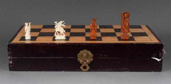 Appraisal: Chinese chess set with carved ivory chessmen th century carved