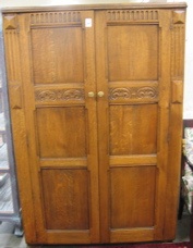 Appraisal: CARVED OAK DOUBLE-DOOR WARDROBE English mid th century having two